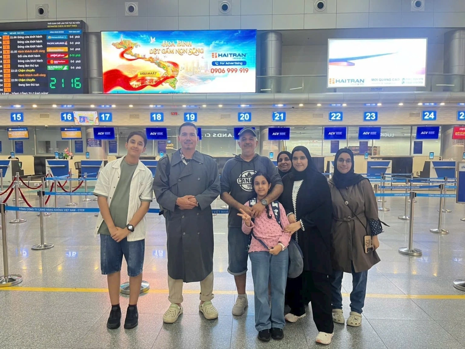 Tuan Abdullah supporting a Muslim family at Da Nang International Airport